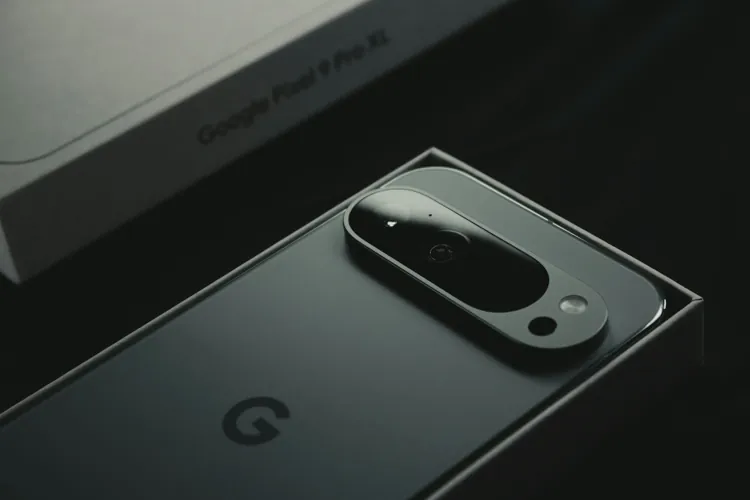 Google Pixel 10 Pro image 2 - A close up of a cell phone near a laptop